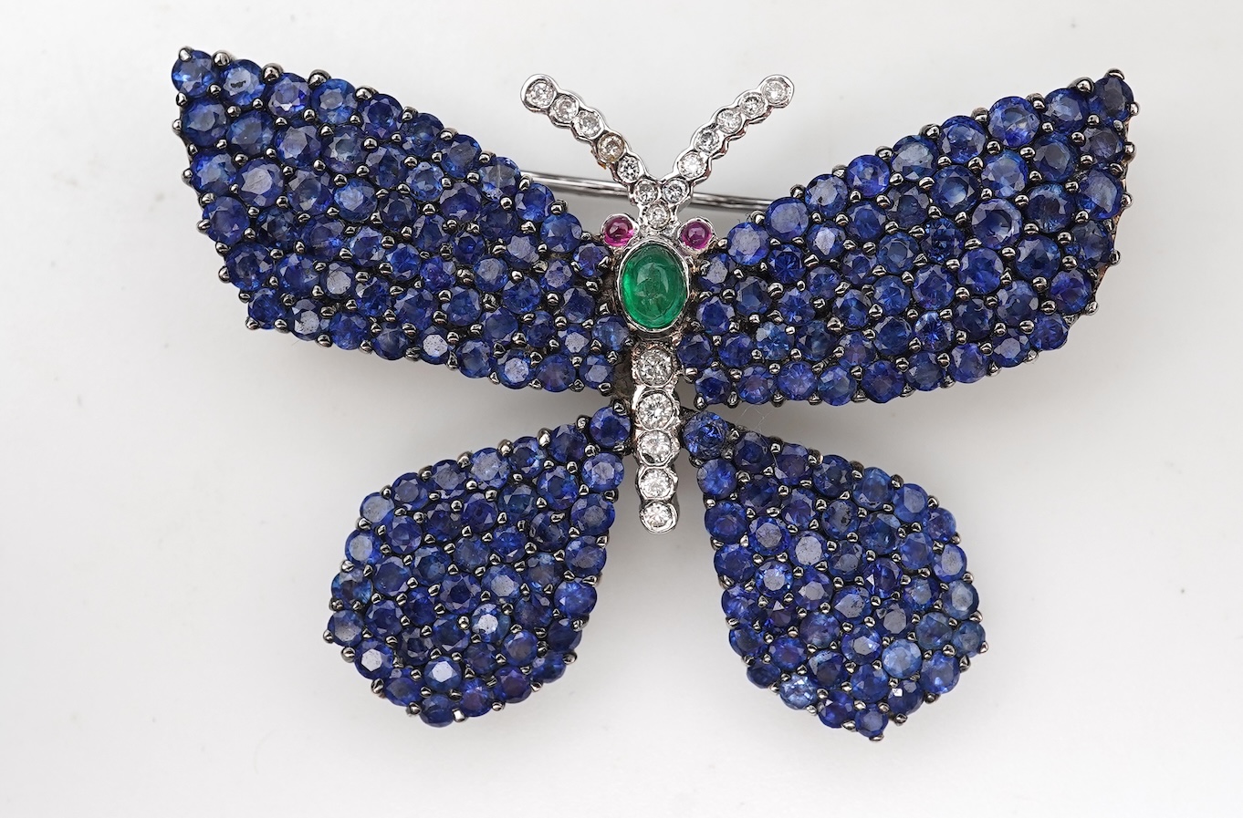 A sapphire, emerald, ruby and diamond brooch